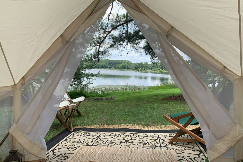 Mobile Glamping tent setup with a view of the lake.